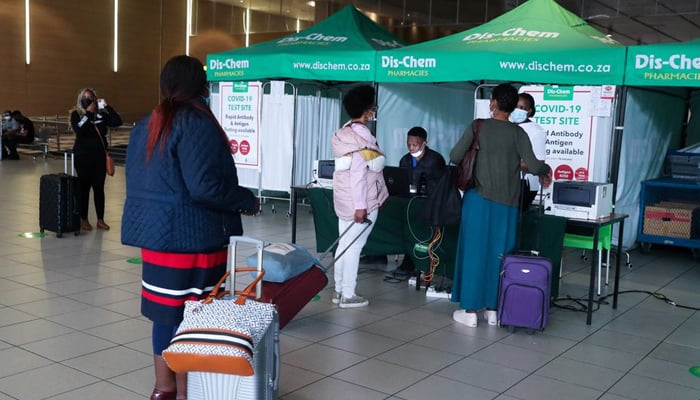 Passengers queue to get a PCR test against the coronavirus disease (COVID-19) before traveling on international flights, at O.R. Tambo International Airport in Johannesburg, South Africa, November 26, 2021. — Reuters/File