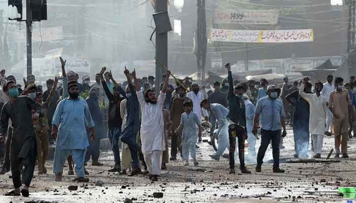 Supporters of Tehreek -e-Labbaik Pakistan shout slogans during a protest in Lahore on April 13, 2021. — AFP