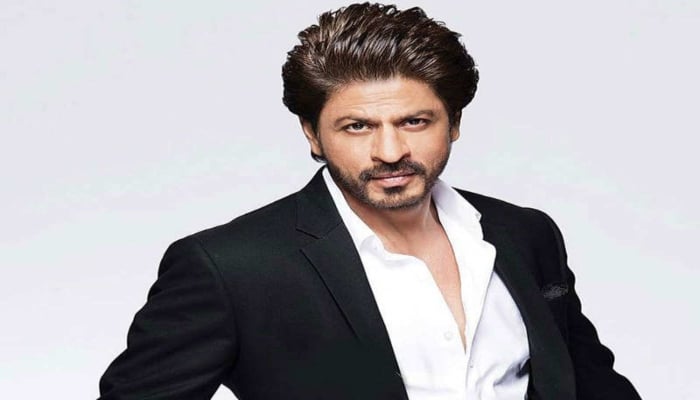 Shah Rukh Khan strikes his ICONIC pose at an event