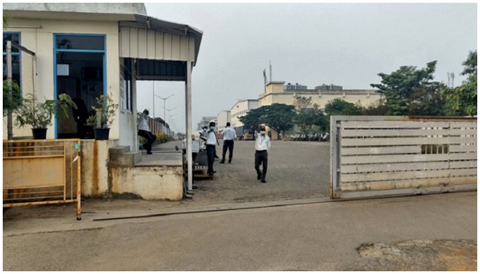 Private security guards stand at the entrance of a closed plant of Foxconn India, which makes iPhones for Apple Inc, near Chennai, India, on Dec 22. — Reuters/File