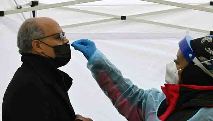 A man gets tested for Covid-19 at a testing site in Washington, DC, on December 29, 2021.-AFP