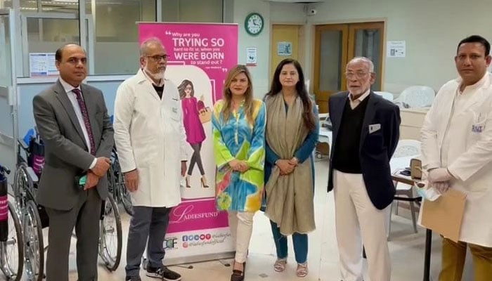 Dawood Global Foundation President Tara Uzra Dawood along with Farha Huma and Ghulam Muhammad Abbasi hands over the wheelchairs to SIUT.