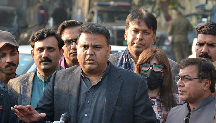 Minister for Information and Broadcasting Fawadspeaking to reporters in Lahore, on December 31, 2021. — PID