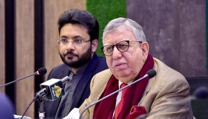 Federal Minister for Finance and Revenue Shaukat Tarin, addressing a press conference along with Minister of State for Information and Broadcasting Farrukh Habib on December 30, 2021. Photo: Courtesy PID