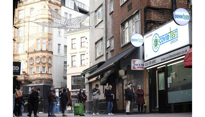 People queue outside a private COVID-19 testing facility, amid the coronavirus outbreak, in central London, Britain, January 2, 2022. — Reuters/File