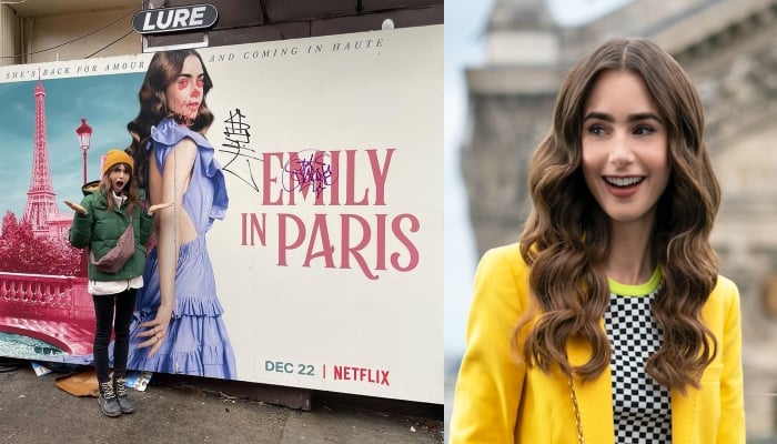 Lily Collins poses next to a graffitied poster of ‘Emily In Paris’ in New York