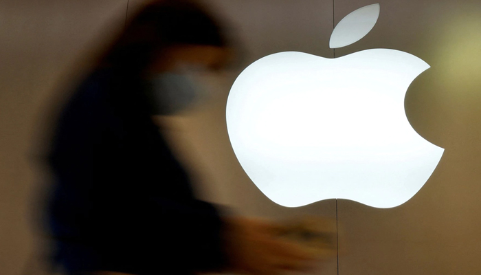A woman walks past an Apple logo in front of an Apple store in Saint-Herblain near Nantes, France, September 16, 2021. — Reuters/File