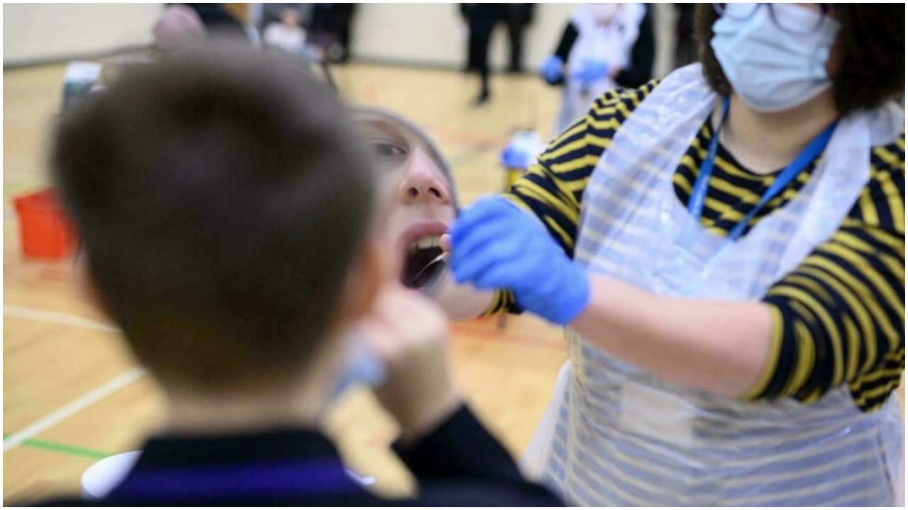 A health worker takes a mouth swab for coronavirus diagnostic test. — AFP