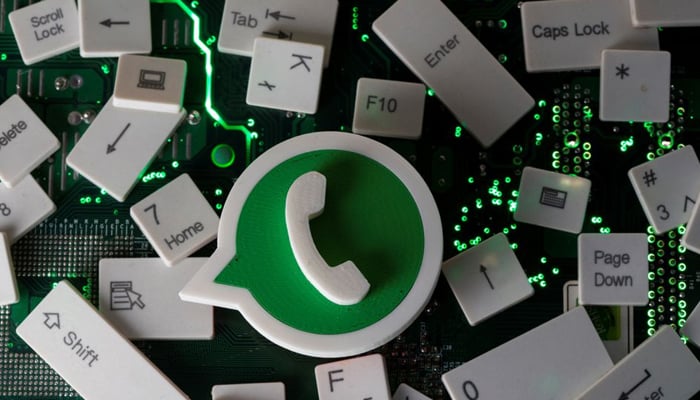 A 3D printed WhatsApp logo and keyboard buttons are placed on a computer motherboard in this illustration taken January 21, 2021. — Reuters/File