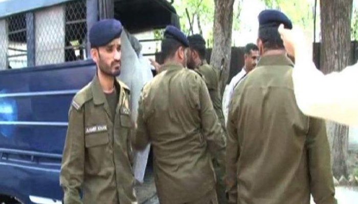 Punjab police officials stand near a police van. Photo: Geo.tv/files