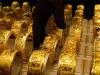 Gold cuts losses as rupee slips against US dollar
