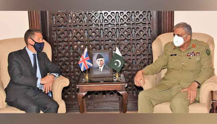 Chief of Army Staff General Qamar Javed Bajwa (R) in a meeting with British High Commissioner Dr Christian Turner, on June 18, 2021. — ISPR