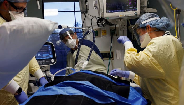 Medical staff treat a coronavirus disease (COVID-19) patient in their isolation room on the Intensive Care Unit (ICU) at Western Reserve Hospital in Cuyahoga Falls, Ohio, US, January 4, 2022. — Reuters/File