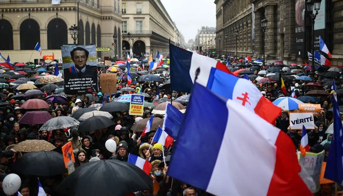 Demonstrators gather during a protest against the health pass and Covid-19 vaccines after the call of leader of French nationalist party Les Patriotes (The Patriots) Florian Philippot, at Place du Palais-Royal, Paris, on January 8, 2022. AFP