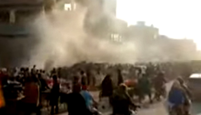 Smoke rises into the air following an explosion in a sewerage drain, in Karachis Sher Shah area, on January 9, 2022. — Geo News