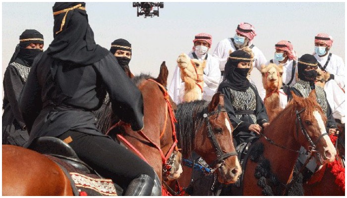 Saudi women attend the sixth edition of the King Abdulaziz Camel Festival in the Rumah region, some 161km east of the capital Riyadh, on Saturday. — AFP