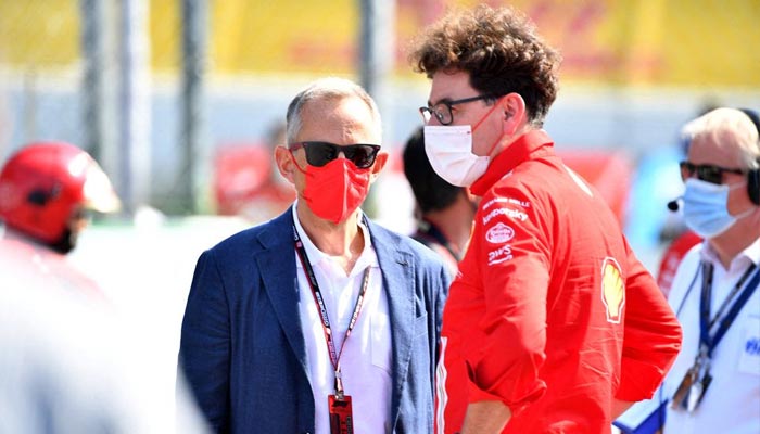 Monza, Italy - September 12, 2021 Ferrari CEO Benedetto Vigna and team principal Mattia Binotto are seen in protective face masks on the grid before the race.— Reuters/File