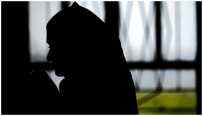 Picture showing the silhouette of a woman — AFP