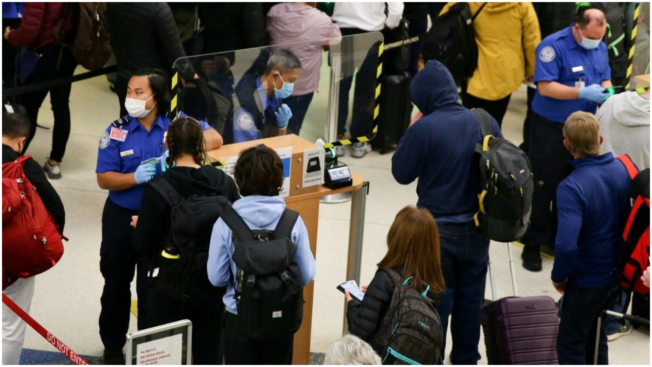 People waiting in a queue at an airport in the US.— Reuters