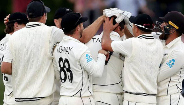Teammates gather around Ross Taylor after he takes Bangladeshs final wicket. — AFP/File