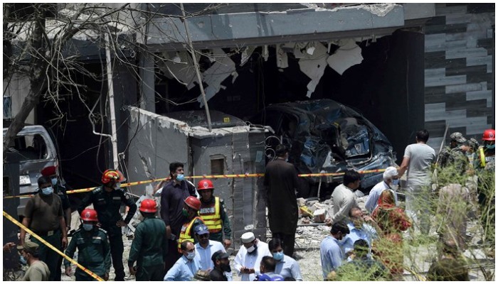 Security officials inspect the site of an explosion that killed at least three people and wounded several others in Lahore on June 23, 2021. — AFP/File