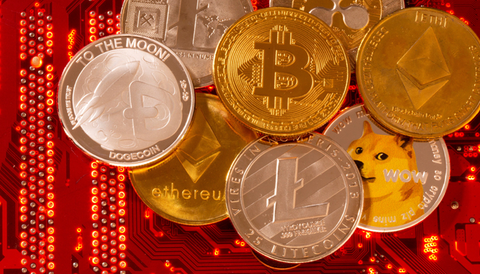 Representations of cryptocurrencies Bitcoin, Ethereum, DogeCoin, Ripple, Litecoin are placed on PC motherboard in this illustration taken, June 29, 2021. — Reuters/File