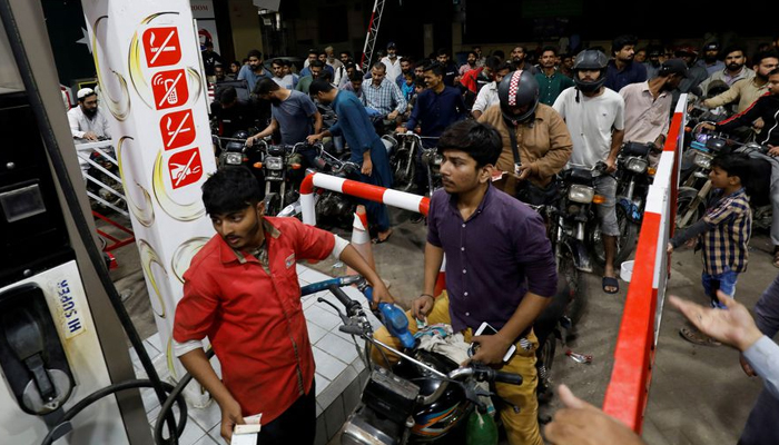 People gather to get petrol at a petrol station, after Pakistan Petroleum Dealers Association (PPDA) announced a countrywide strike, in Karachi, Pakistan November 24, 2021. — Reuters/File