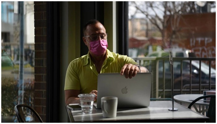 A man wearing a mask works on his laptop as the state of Texas prepares to lift its mask mandate and reopen businesses to full capacity during the coronavirus disease (COVID-19) pandemic in Houston, Texas, US, March 9, 2021.— Reuters/File