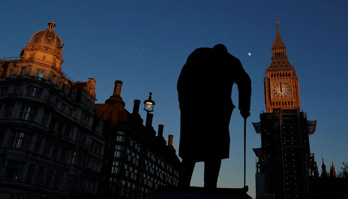 The Elizabeth Tower, more commonly known as Big Ben, is seen with hands fixed at twelve oclock, whilst Britains domestic spy service MI5 has told the House of Commons speaker that the Chinese Communist Party has been employing a woman to exert improper influence over lawmakers, at the Houses of Parliament in London, Britain, January 13, 2022. REUTERS