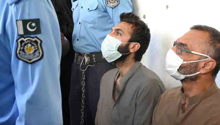 Prime accused in Noor Mukadams case Zahir Jaffer (second from right) waits outside an Islamabad court. -PPI