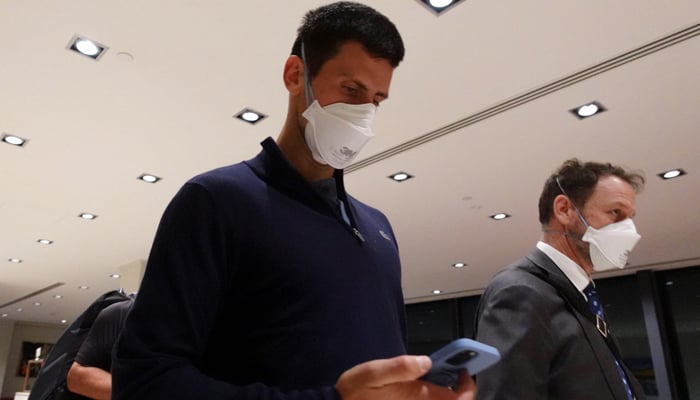 Serbian tennis player Novak Djokovic walks in Melbourne Airport before boarding a flight, after the Federal Court upheld a government decision to cancel his visa to play in the Australian Open, in Melbourne, Australia, January 16, 2022. — Reuters/Loren Elliott