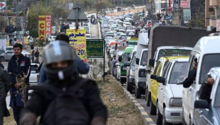 Tourists’ vehicles heading to Murree stuck in a traffic in the outskirts of Islamabad on 8 January 2022. Picture: AFP