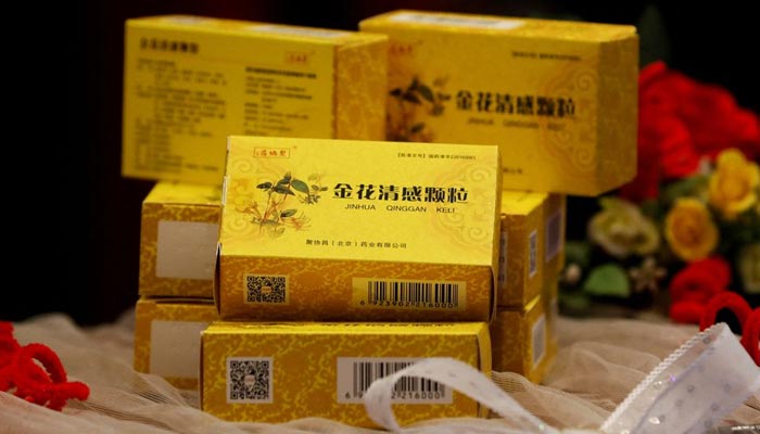 Packs of Chinese traditional herbal medicine Jinhua Qinggan Granules (JHQG) for the treatment of coronavirus (COVID-19) disease are displayed during a ceremony after completion of clinical trial on the efficacy and safety, at the International Centre for Chemical and Biological Sciences of Karachi University in Pakistan January 17, 2022. — Reuters