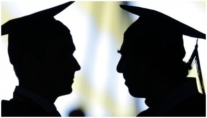 Image showing silhouettes of two people wearing mortar boards — AFP/File