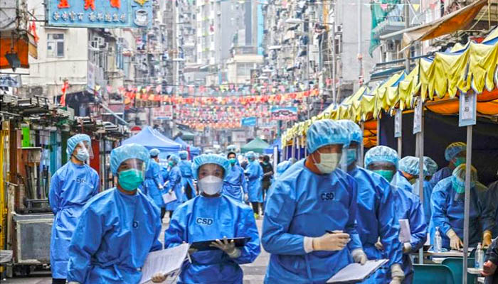 Health workers geared up inspecting the Jordan residential area of Kowloon. — Reuters/File