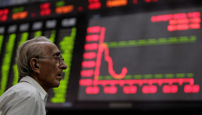 A worried investor can be seen looking at the digital stock board at the Pakistan Stock Exchange (PSX). — Reuters/File