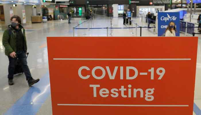 A sign advertises coronavirus disease (COVID-19) testing ahead of the Thanksgiving holiday at Logan International Airport in Boston, Massachusetts, US, November 22, 2021. — Reuters/File