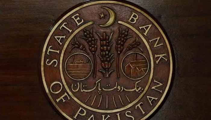 A logo of the State Bank of Pakistan is pictured at a reception desk at the head office in Karachi, July 16, 2019. Photo: Reuters