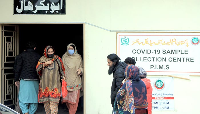 People arrive at coronavirus testing centre at Pakistan Institute of Medical Sciences (PIMS) in Islamabad, on December 19, 2022. — INP