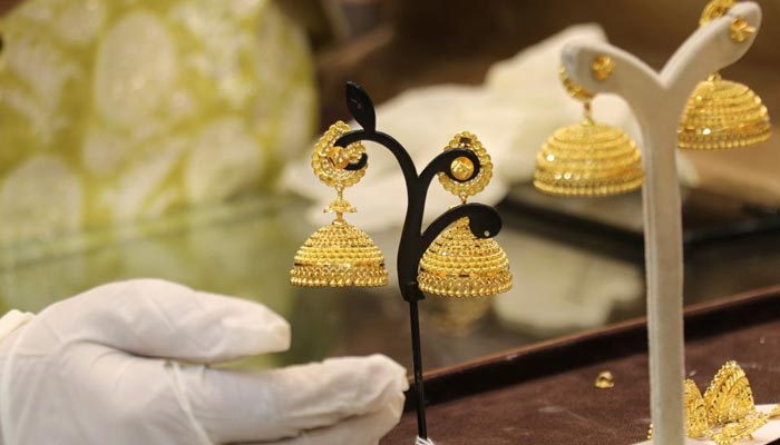 Gold earings are displayed at a jewellery shop. — Reuters/File