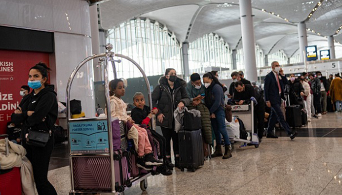 Stranded passengers wait at Istanbul airport, where flights are cancelled due to blizzard and heavy snowfall, in Istanbul, Turkey, on January 25, 2022. — AFP/File