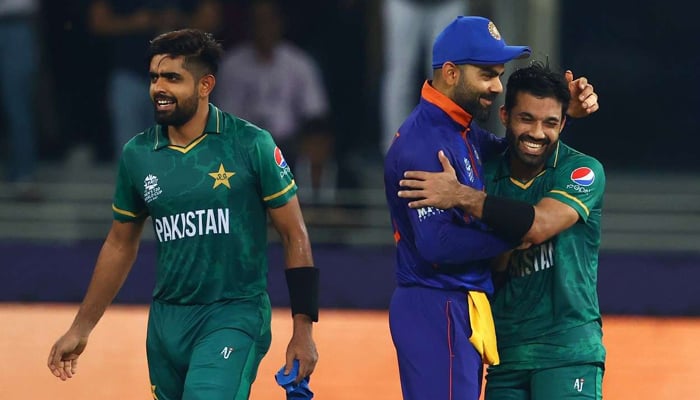 Pakistan cricketer Babar Azam (L), Indian cricketer Virat Kohli (M), Pakistan cricketer Mohammad Rizwan share moments after  Ind vs Pak game on October 24, 2021. — ICC/File