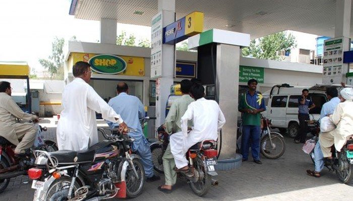 Motorcyclists wait to refill their vehicles fuel tanks at a petrol pump. Photo: Geo.tv/ file
