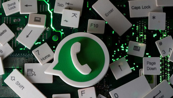 A 3D printed WhatsApp logo and keyboard buttons are placed on a computer motherboard in this illustration taken January 21, 2021. Photo: Reuters