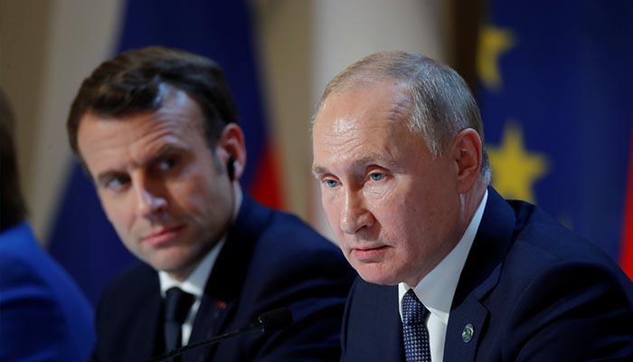 French President Emmanuel Macron and Russias President Vladimir Putin attend a joint news conference after a Normandy-format summit in Paris, France, December 9, 2019. — Reuters/File
