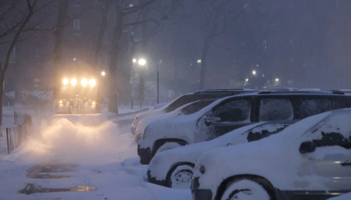 A plow clears a walkway in the snow during a Noreaster storm in Manhattan, New York City, US, January 29, 2022. — Reuters