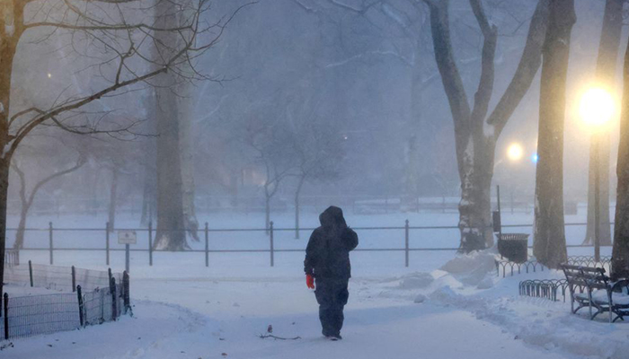 A person walks in the snow during a Noreaster storm in Manhattan, New York City, US, January 29, 2022. — Reuters