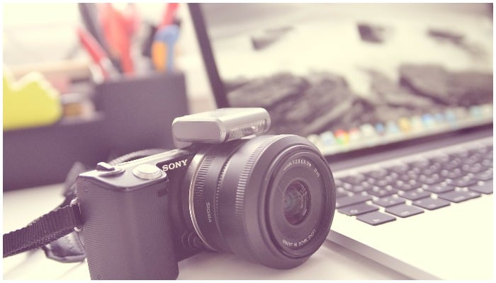 Representational image showing a camera and a laptop — TheAngryTeddy/Pixabay