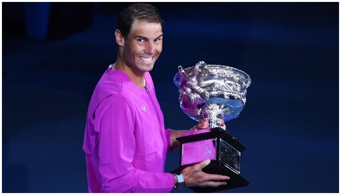 Spains Rafael Nadal holds the trophy after winning the final against Russias Daniil Medvedev at the Australian Open. Photo: AFP