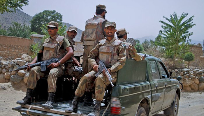 Armed security forces personnel riding in a military van. Photo: ISPR/ file